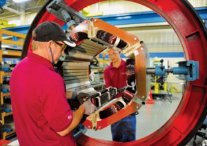Nearly every component of a motor presents an opportunity for energy savings. Here, technicians insert stator coils into a large motor.